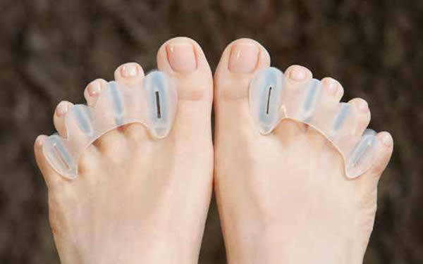 Feet wearing Correct Toes - Silicone Toe Spacers