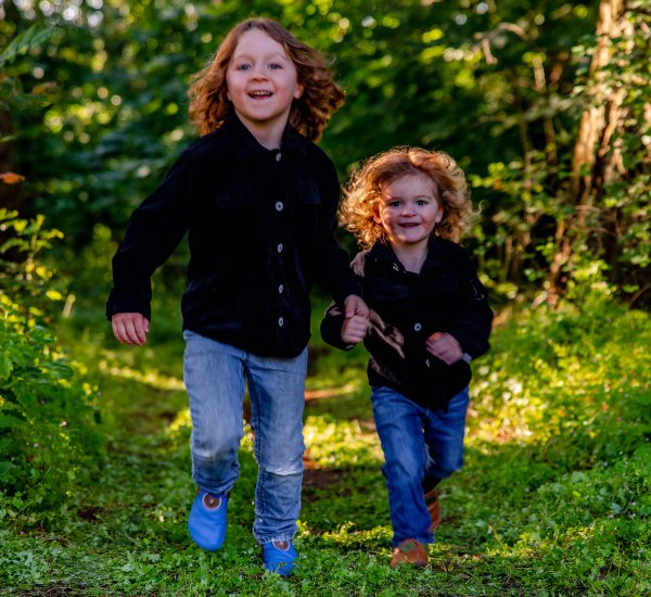 Children holding hands and running in Softstar shoes
